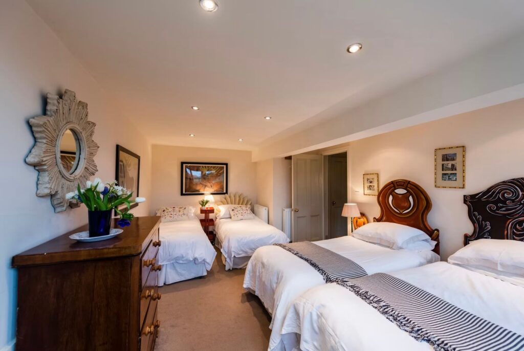Cosy bedroom with four single beds